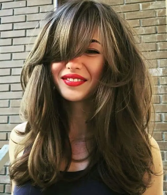 Loose Curls with Long Layered Bangs
