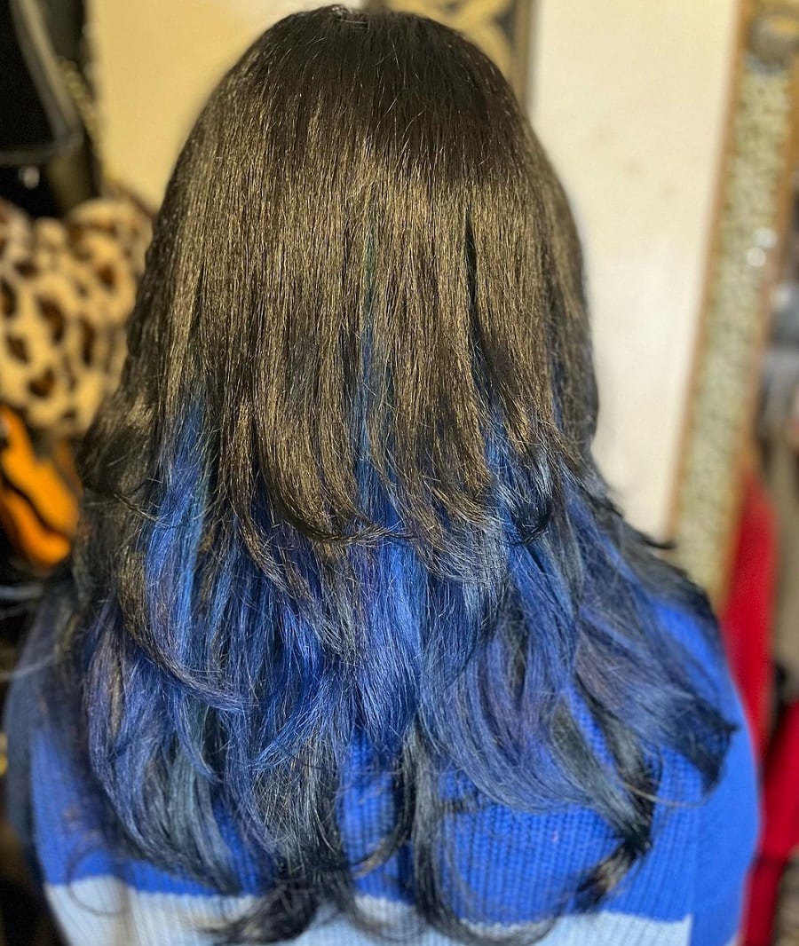 Black hair layered with blue underneath