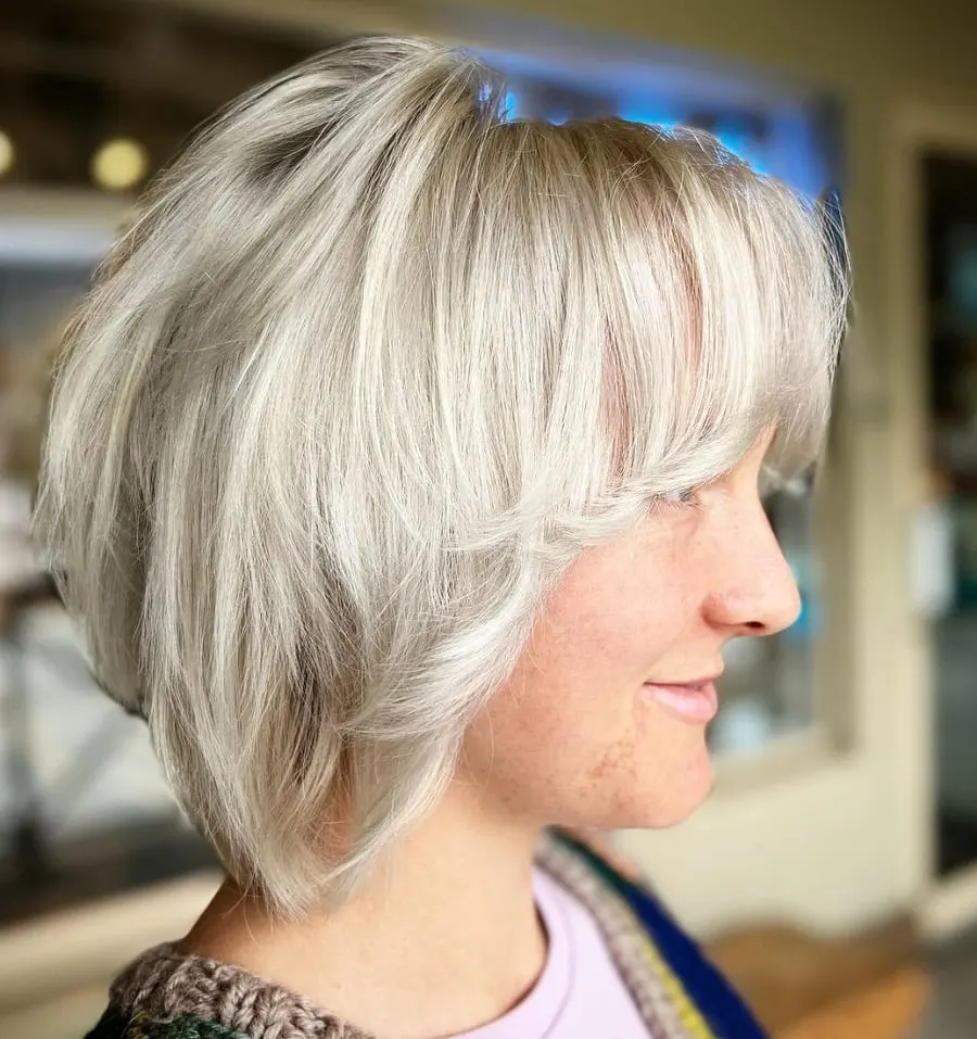 layered bob with curtain bangs for women over 50