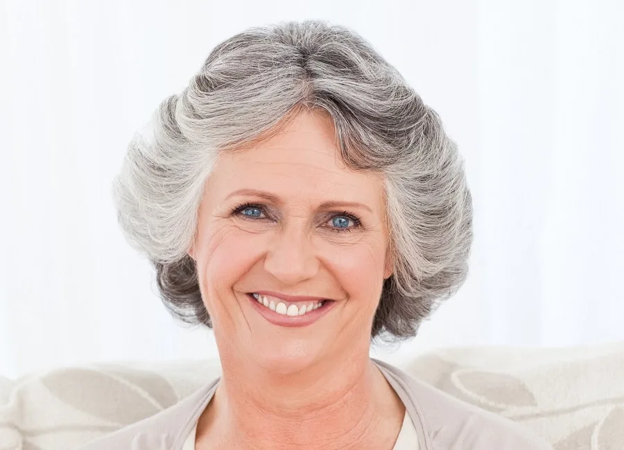 layered feathered hairstyle for women over 60