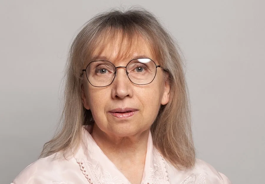 layered haircut with bangs for women over 60 with glasses