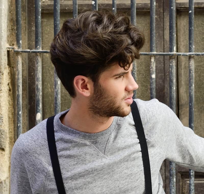 Men's thick layered hair with an undercut