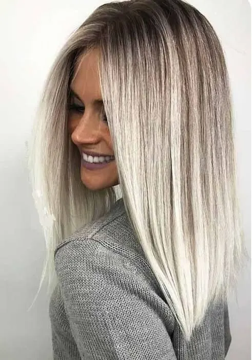 light ash blonde hair with dark root