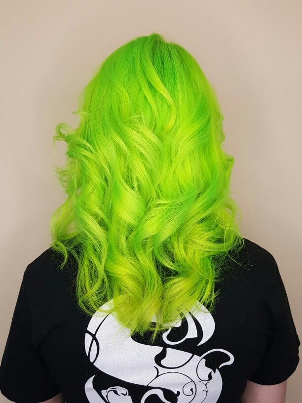 vivid lime green with wavy hair