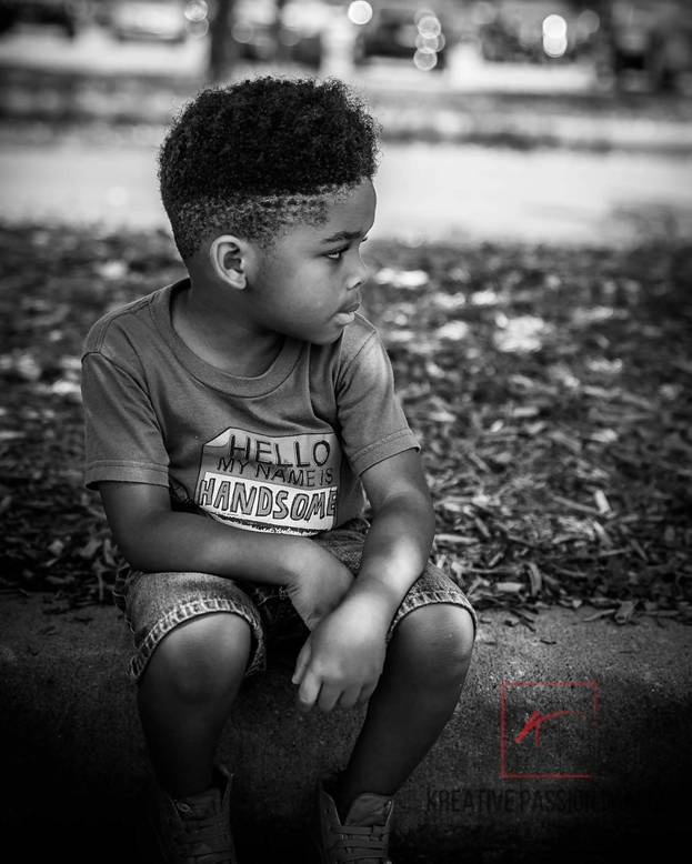 little black boy's hair with curly top