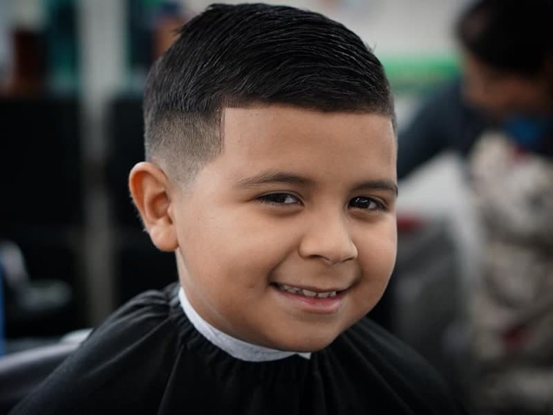 little boy with low fade haircut