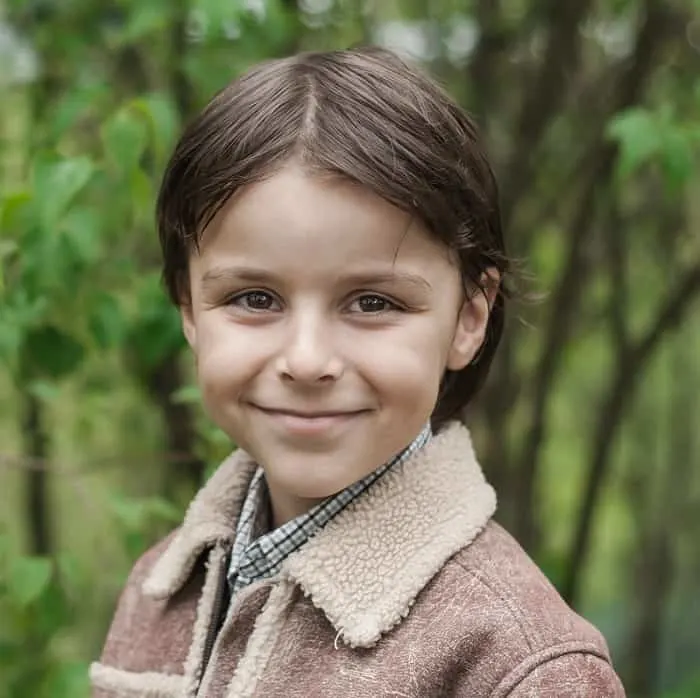 little boy with medium straight hair