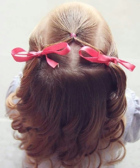 mini pigtails with curly hair