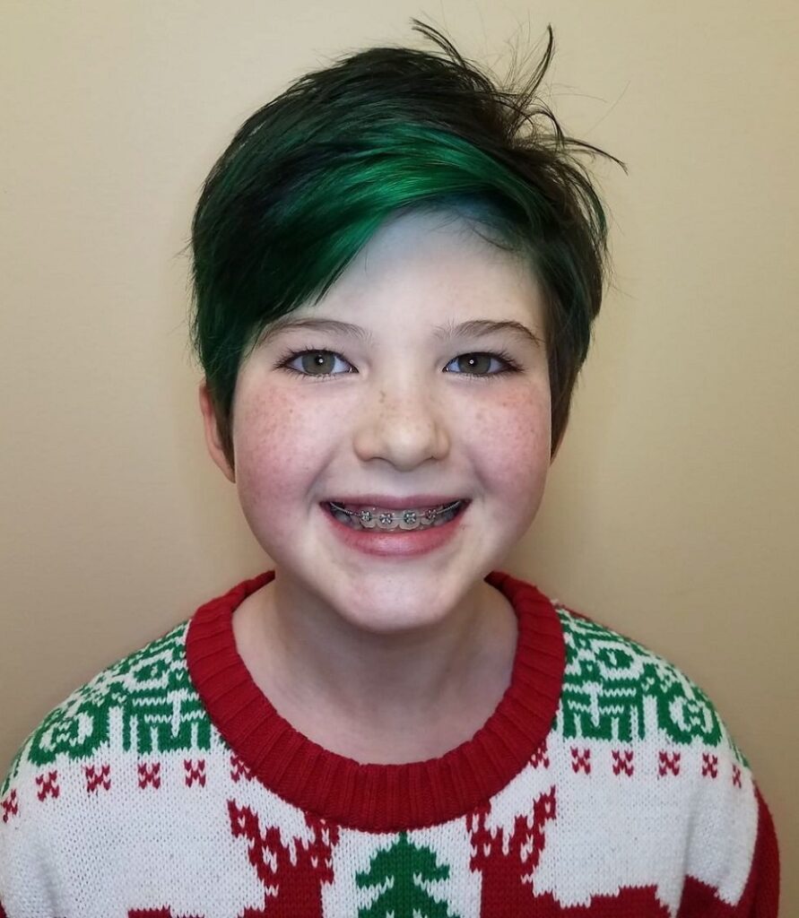 little girl pixie cut with green highlights