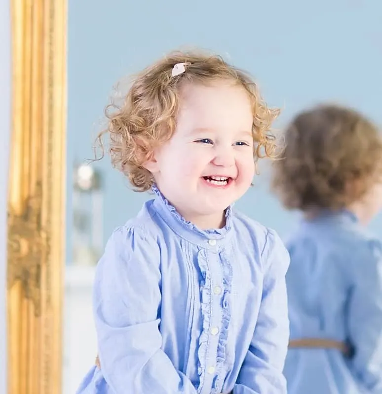 little girl with curly hair