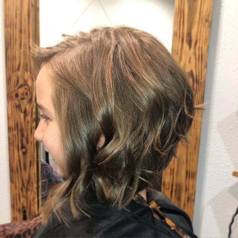 little girl with a wavy long bob haircut