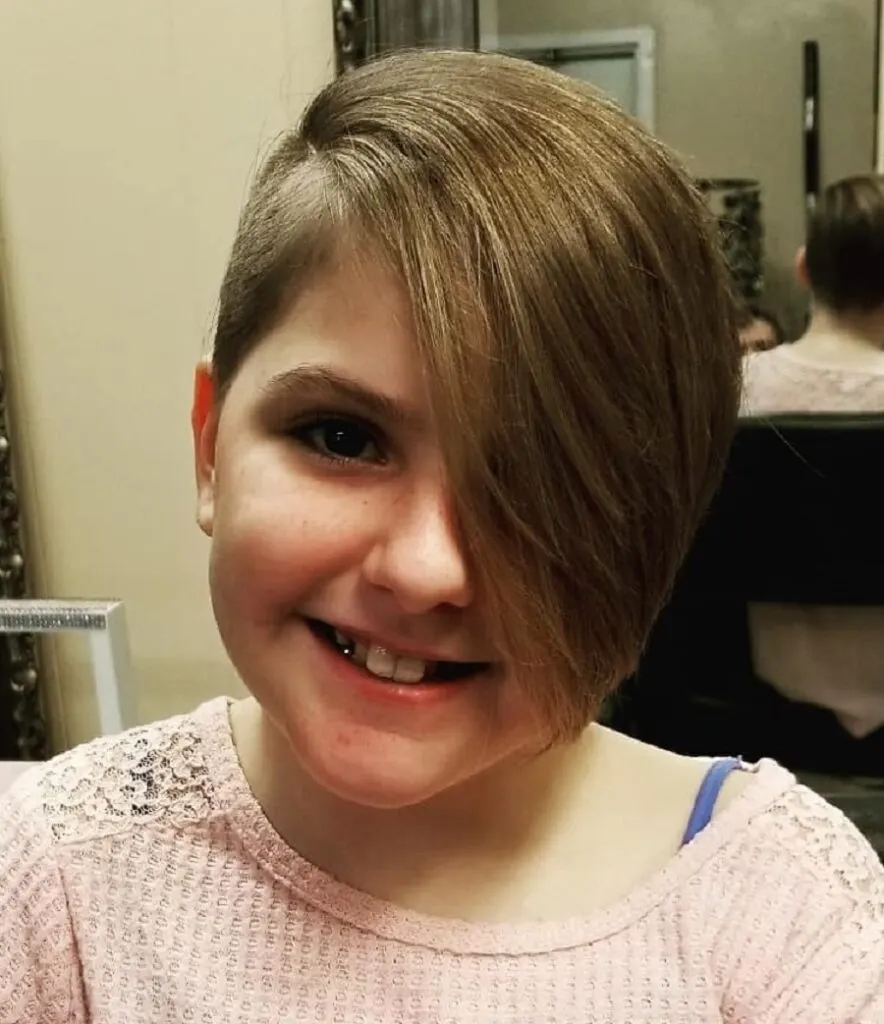 little girl with long pixie cut