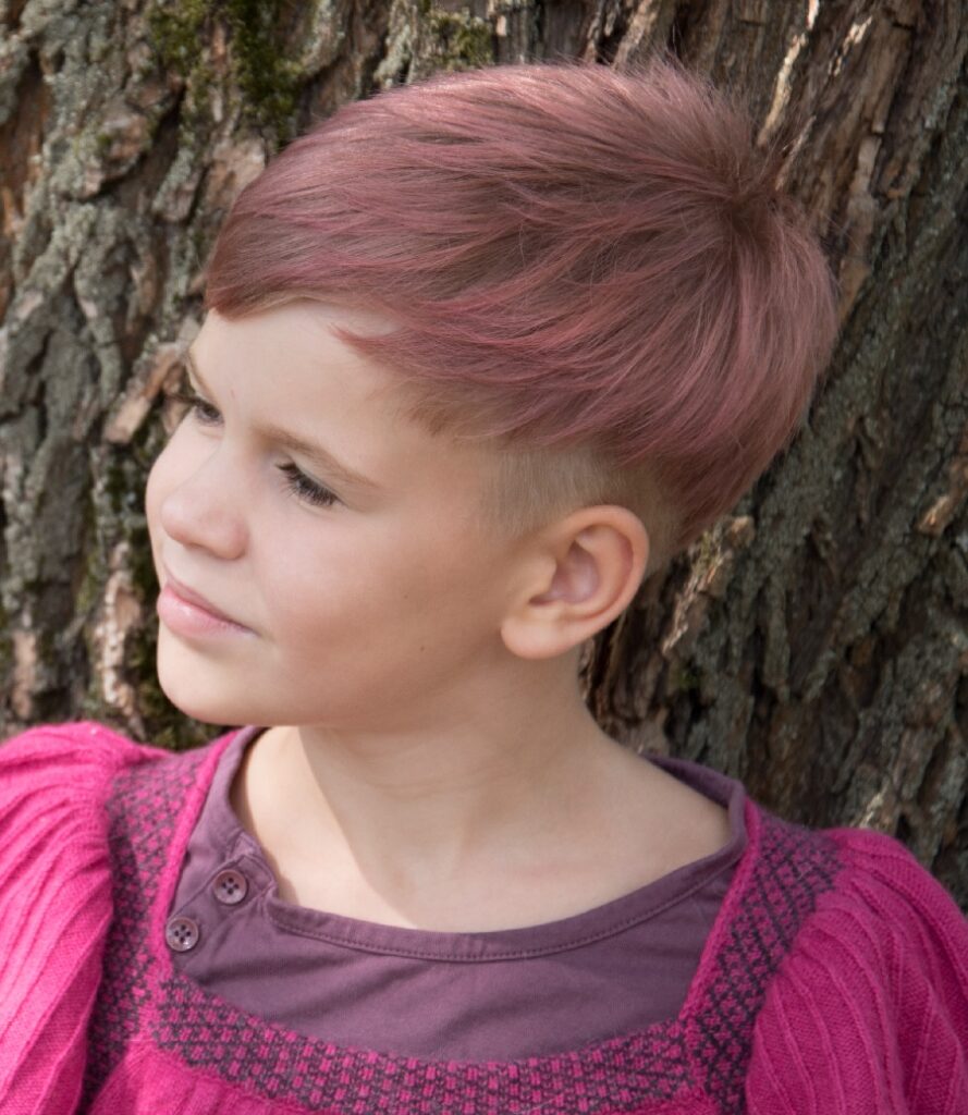 little girl with pink pixie undercut