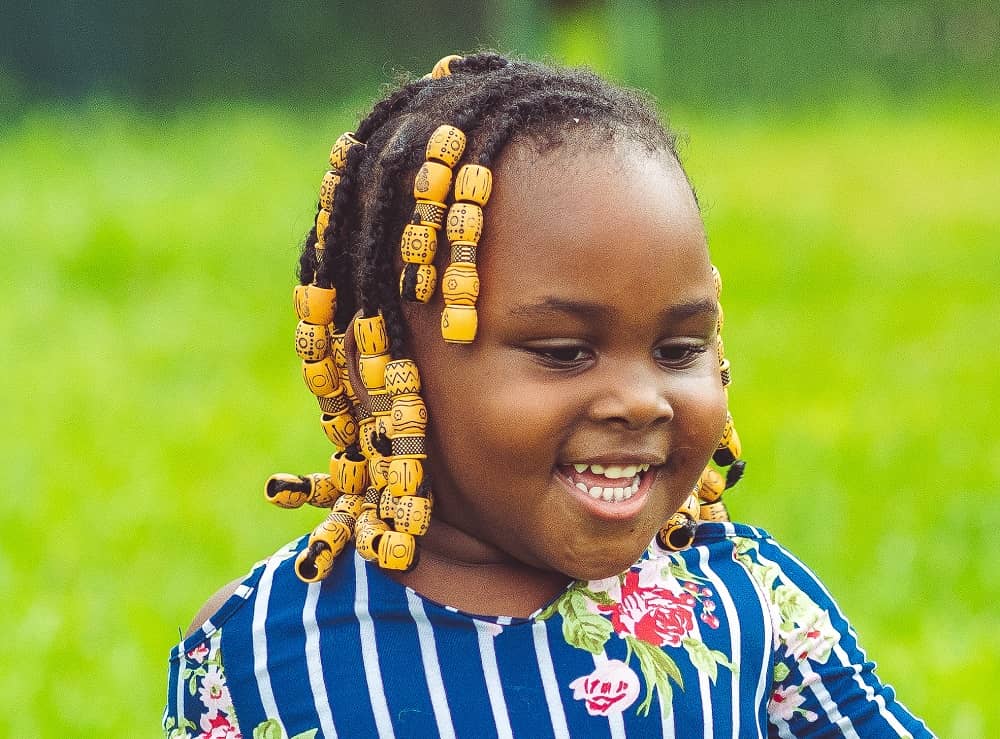 little girl's braids with big beads