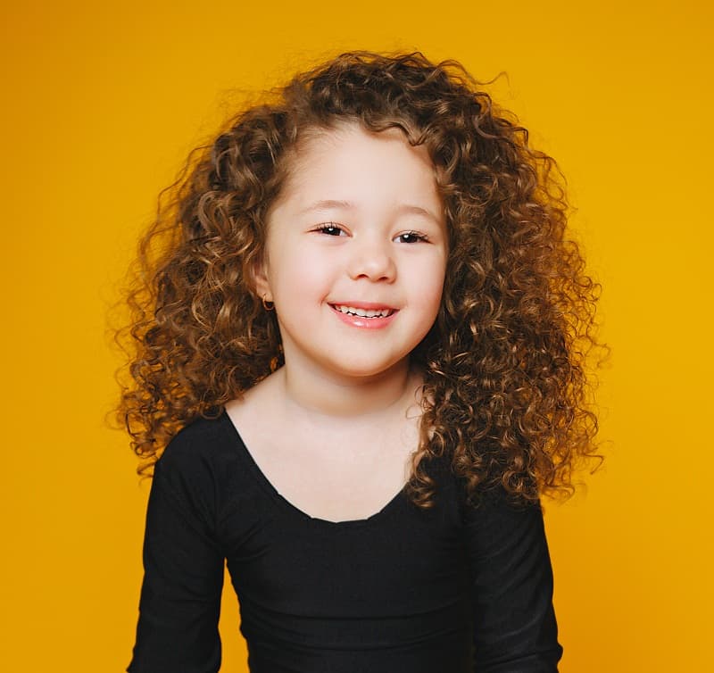 little girl's thick curly hair