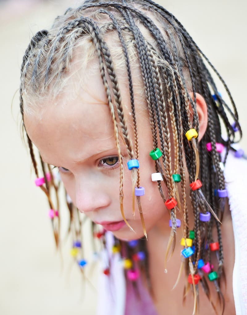 little girl's tiny braids with beads