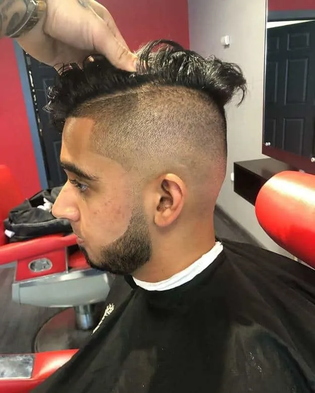 skin fade with long wavy comb over