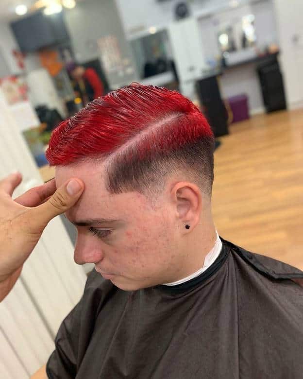 long comb over hair with red highlights 