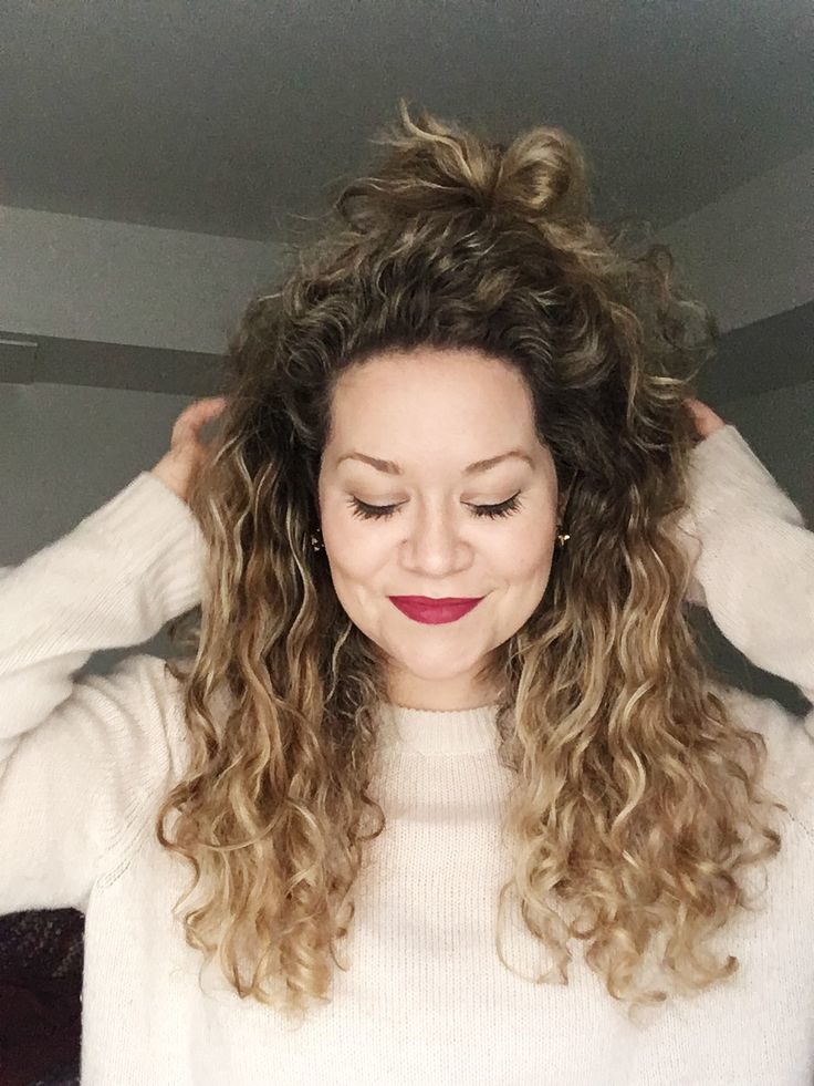 Long curly brown ombre hair into a half-up style