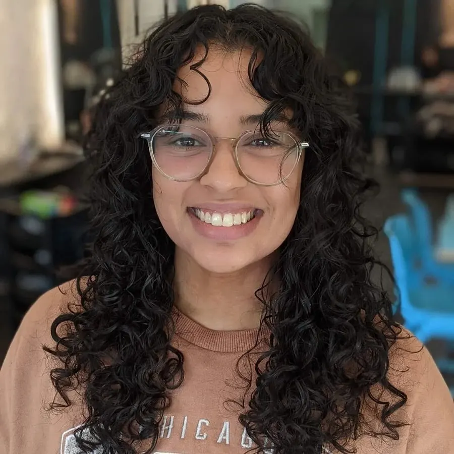 long curly hair with curtain bangs