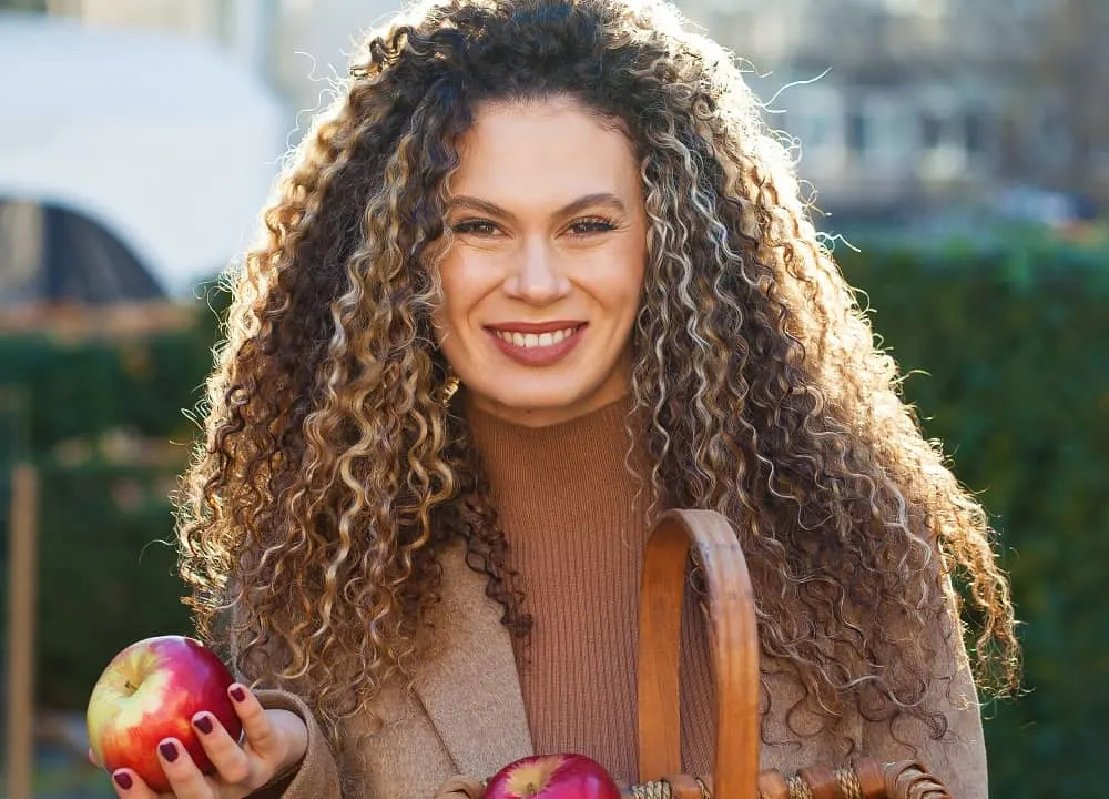 long curly hair with highlights