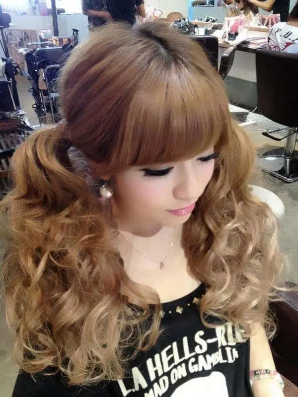 long curly pigtails with bangs