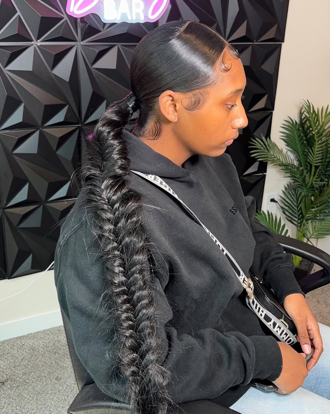 fishtail braid ponytail with a sleek slicked-back top