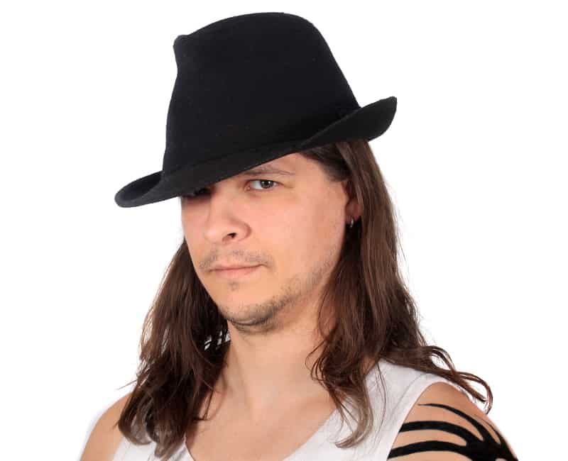 long haired man with fedora hat