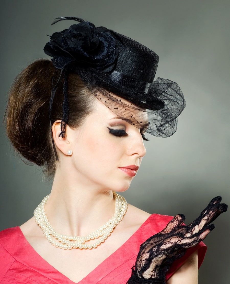 long hairstyle with a fascinator hat