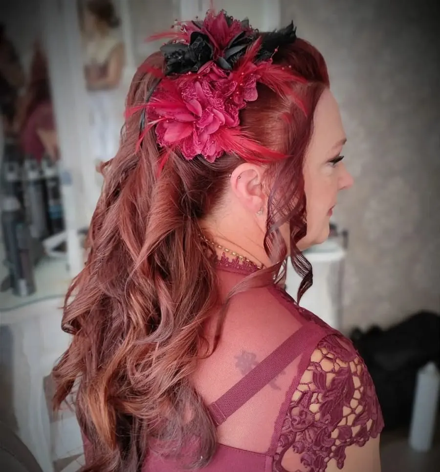 long hairstyle with fascinator for mother of the brides