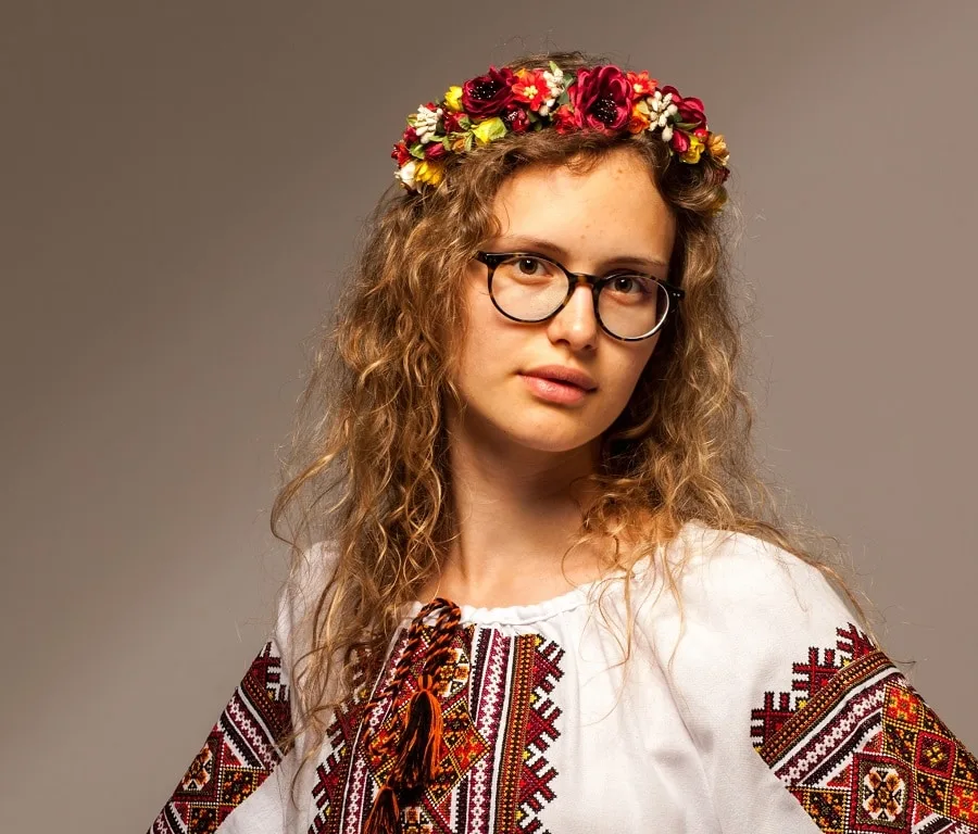 long hairstyle with flower for women with glasses