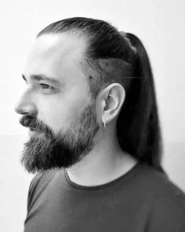 short beard with long ponytail and undercut 
