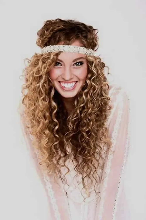 girl with long layered curly hair