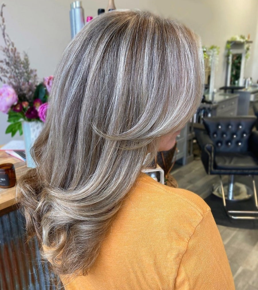 long layered gray hair with blonde highlights