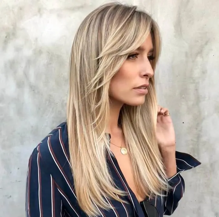 long blonde hair with feathered bangs