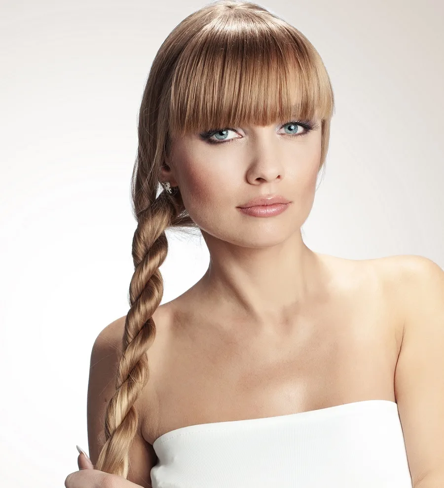 long straight hairstyle with blunt bangs