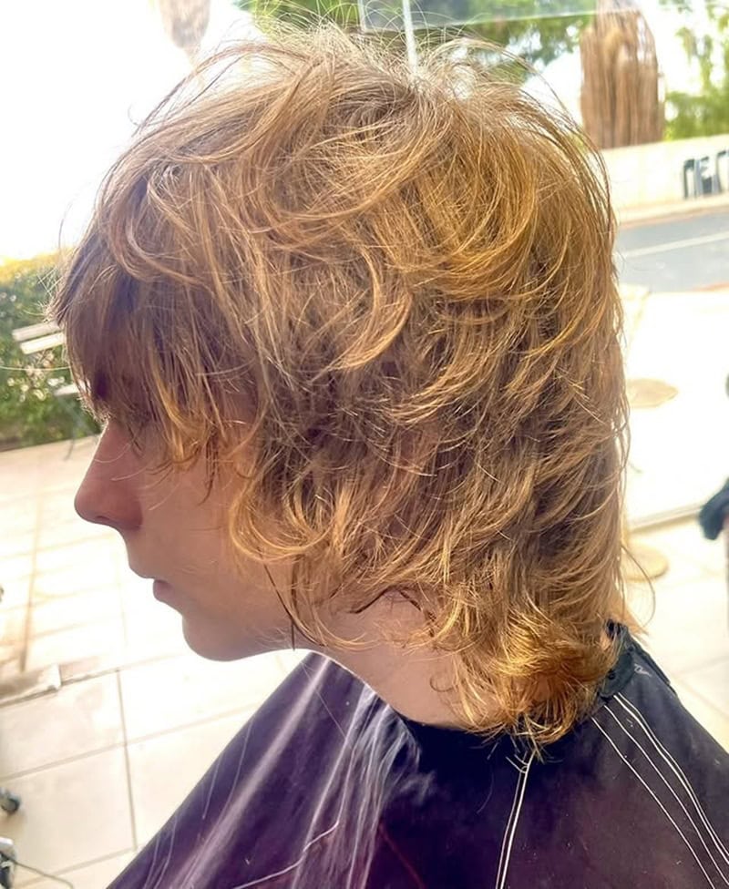 long messy, heavily layered blonde wolf cut