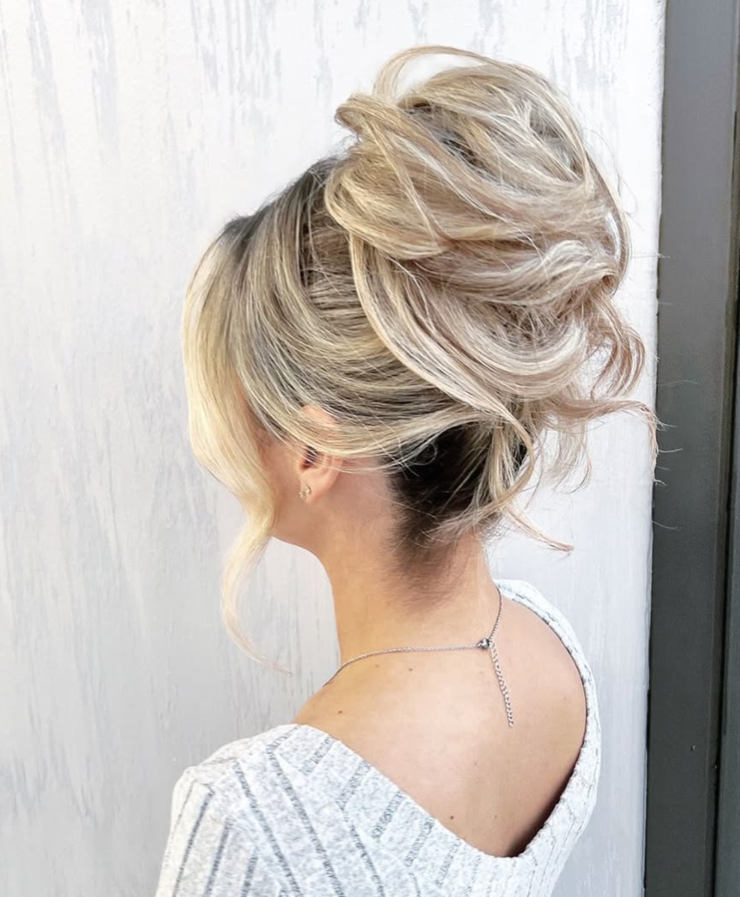 voluminous blonde loose chignon bun