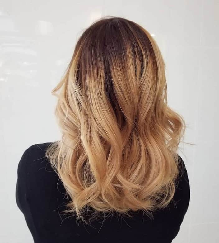 loose curls on honey blonde medium length hair