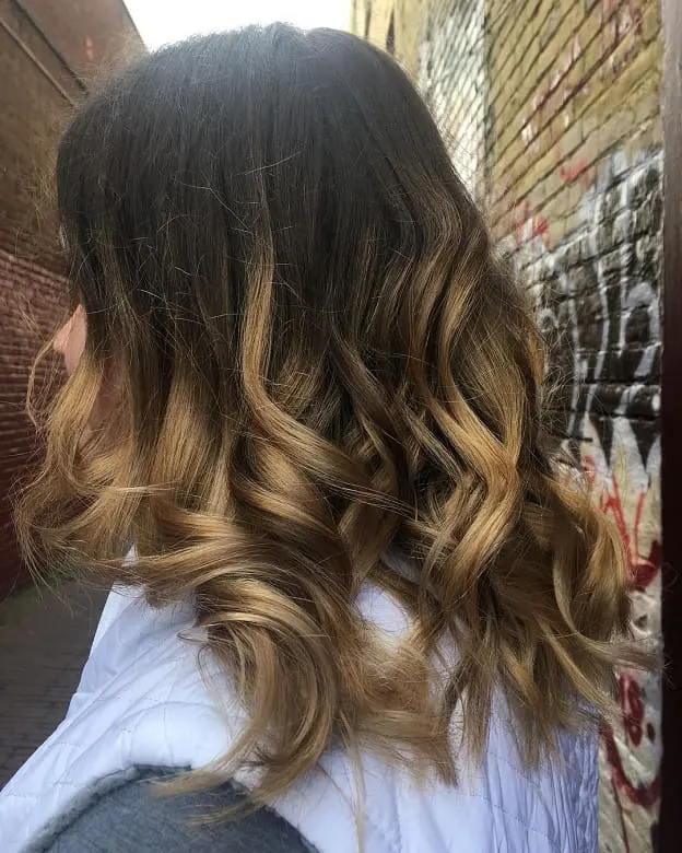 medium length brunette hair with loose curls