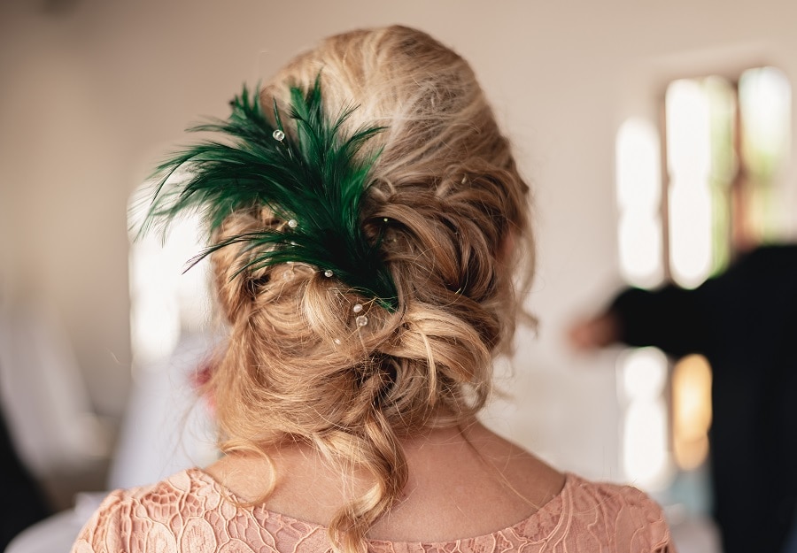 loose updo hairstyle for wedding guest over 50