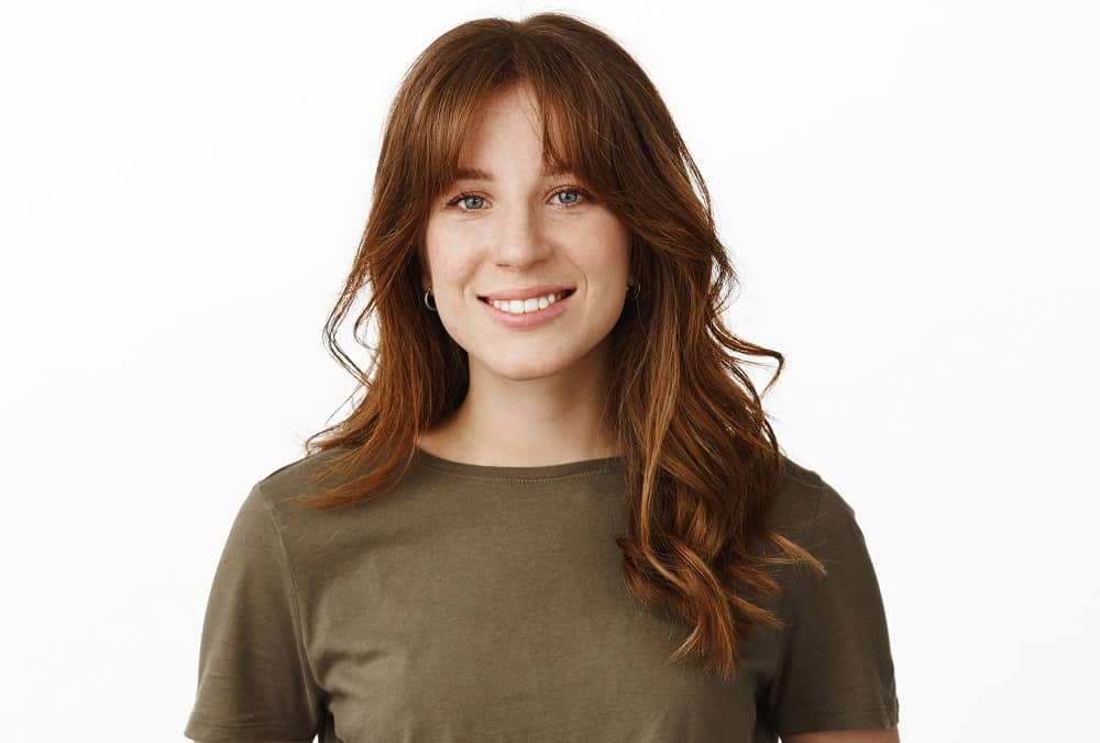 loose wavy hair with middle part bangs