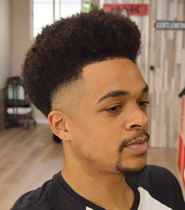 Low Fade Afro Haircut with Voluminous Top