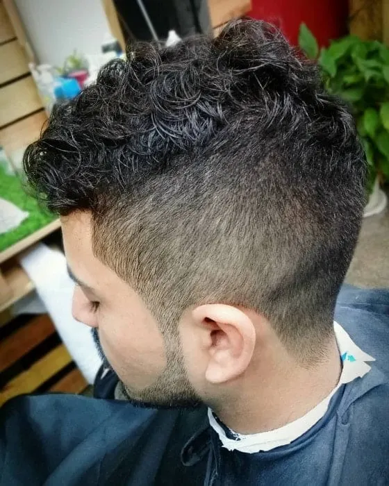 messy curly hair with low fade