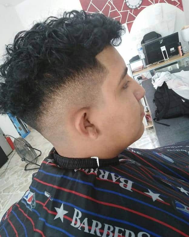 Curly hair with a low undercut fade