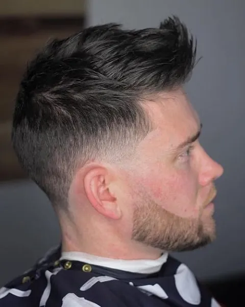 low fade mohawk with a beard