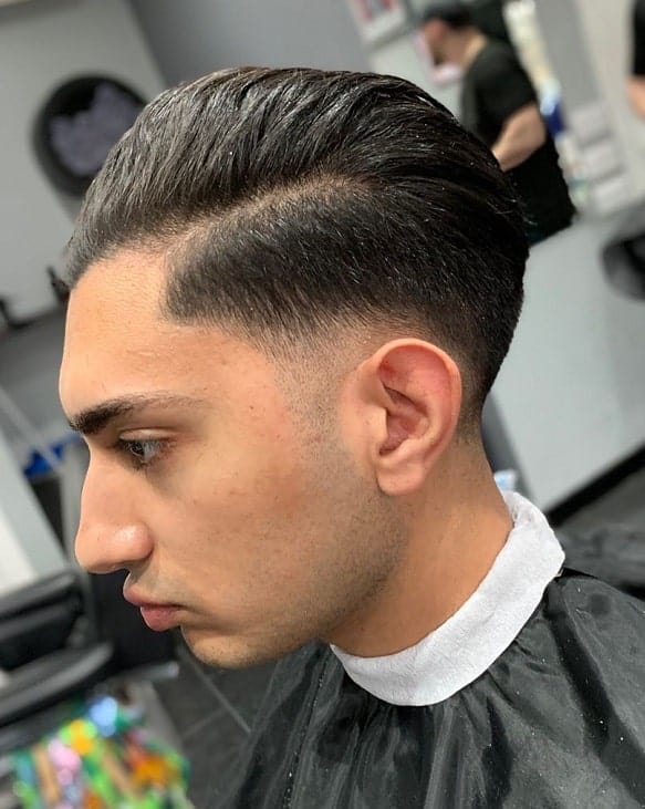 slicked back long hair with low fade