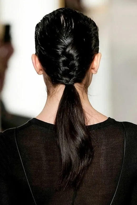 low ponytail with a center braid