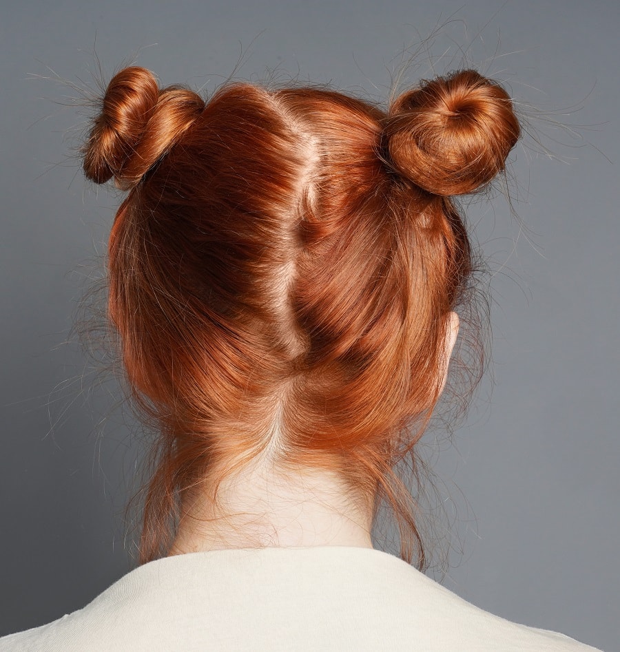 making space buns to create beachy waves
