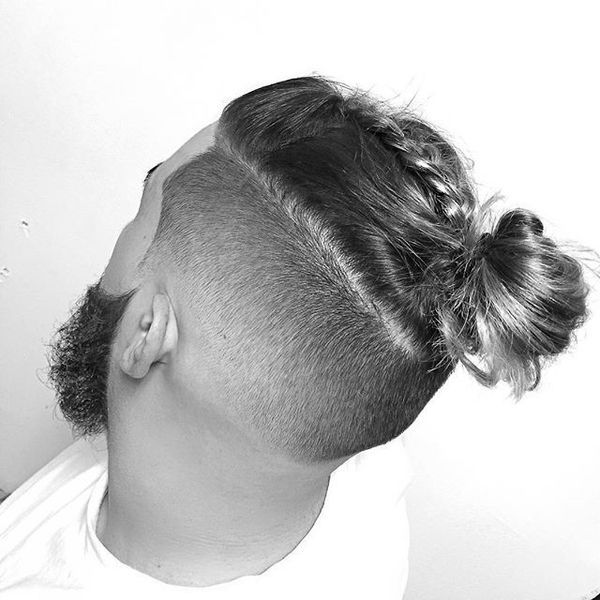 messy man bun with shaved sides & braids